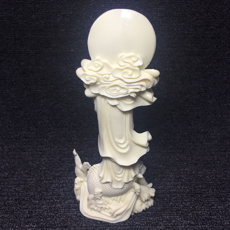 Vegetable ivory Guanyin Bodhisattva sculpture standing above carp with halo and flowing robes