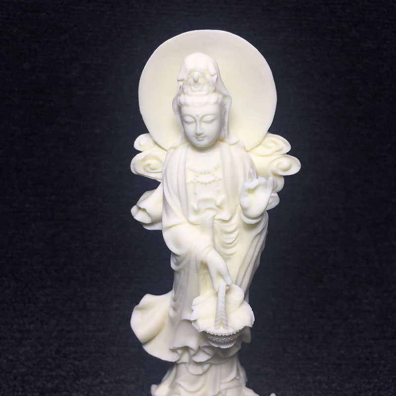Close-up ivory nut Guanyin carving with serene face, halo and lotus details, Chinese spiritual decor