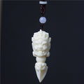 Ivory nut Jiangmo Chu ritual-dagger-inspired pendant with wrathful multi-faced carving, tagua vegetable ivory Chinese cultural hanging ornament