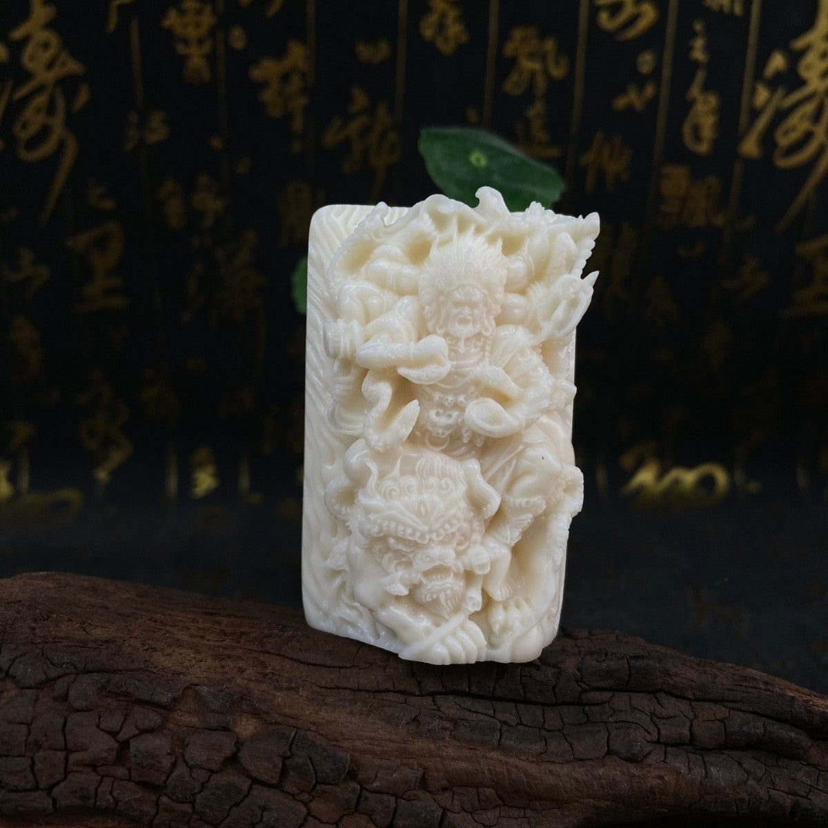 Ivory nut Mahakala Daheitian wrathful Buddhist protector carving front view, tagua vegetable ivory handpiece and hanging ornament
