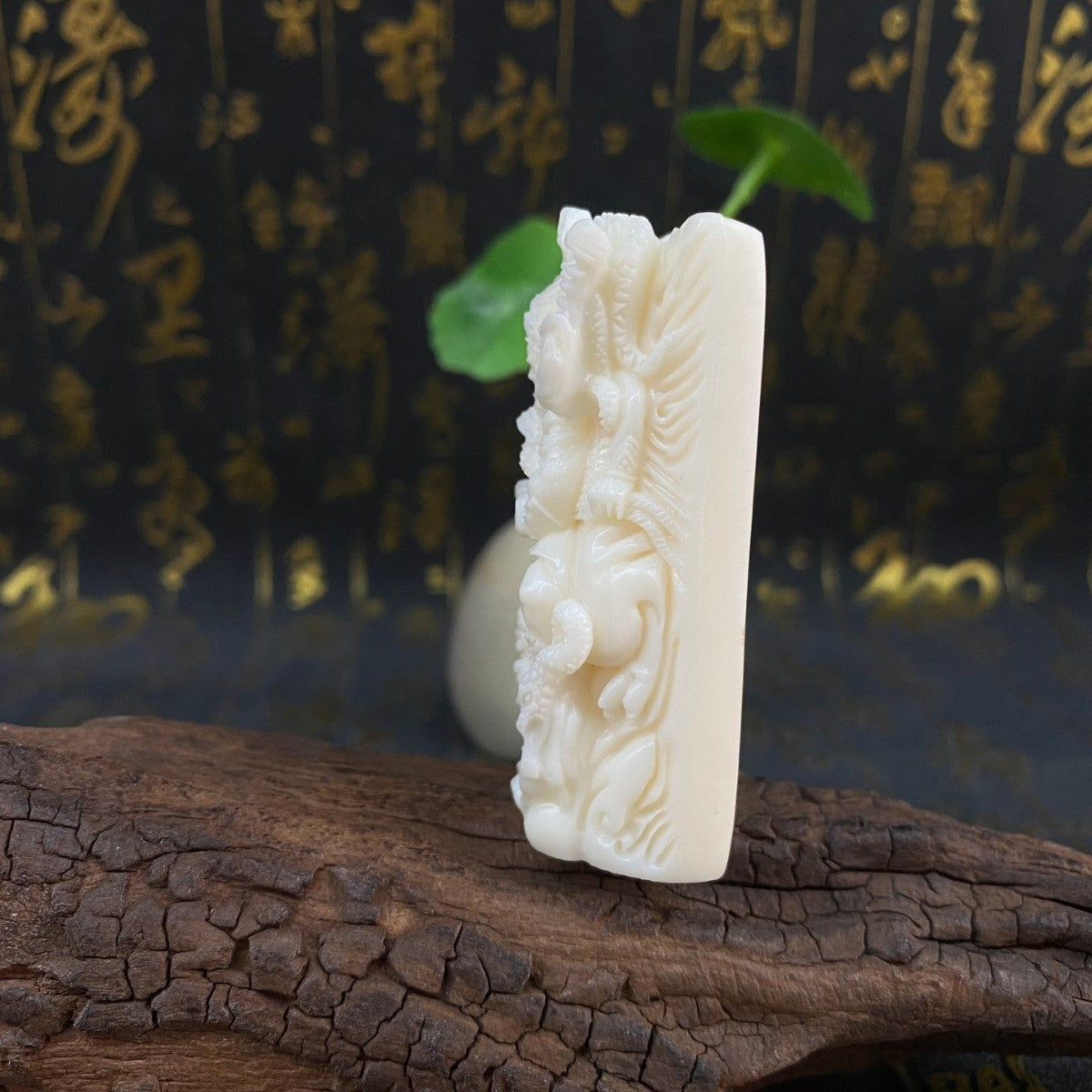 Side view ivory nut Mahakala Daheitian Buddhist protector carving, tagua vegetable ivory relief handpiece with deep sculptural detail