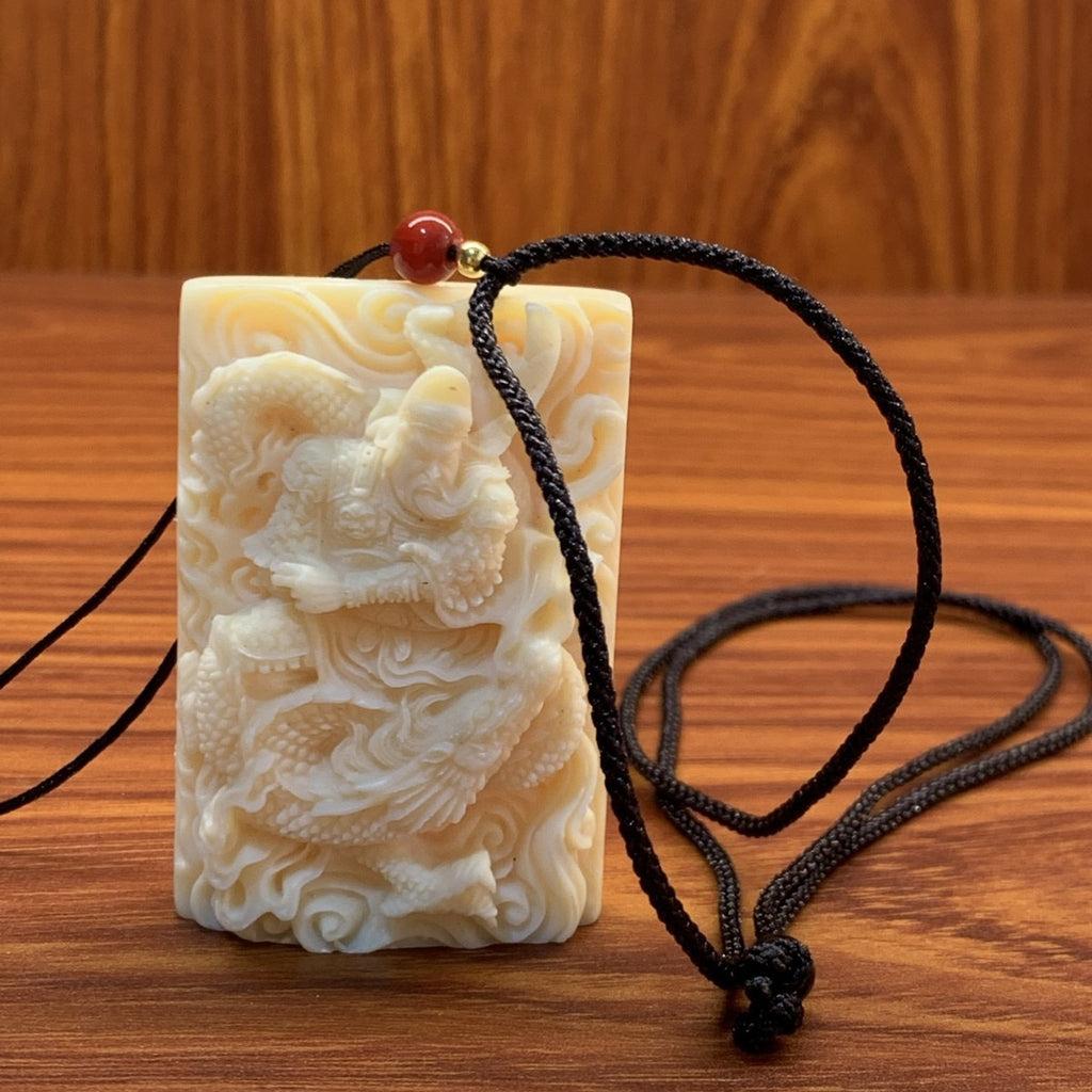 Ivory nut Guan Yu plaque pendant with black cord, tagua vegetable ivory Guan Gong warrior relief carving approximately 3.7 × 1 × 5.5 cm