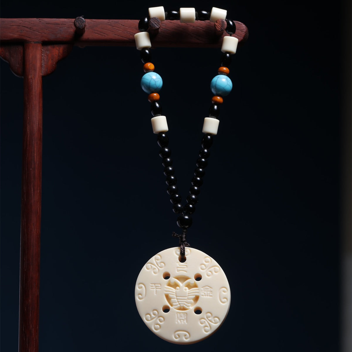 Ivory nut Qibao Qianjin peace buckle hanging ornament with black, blue and ivory-tone beads, tagua vegetable ivory Chinese auspicious car charm