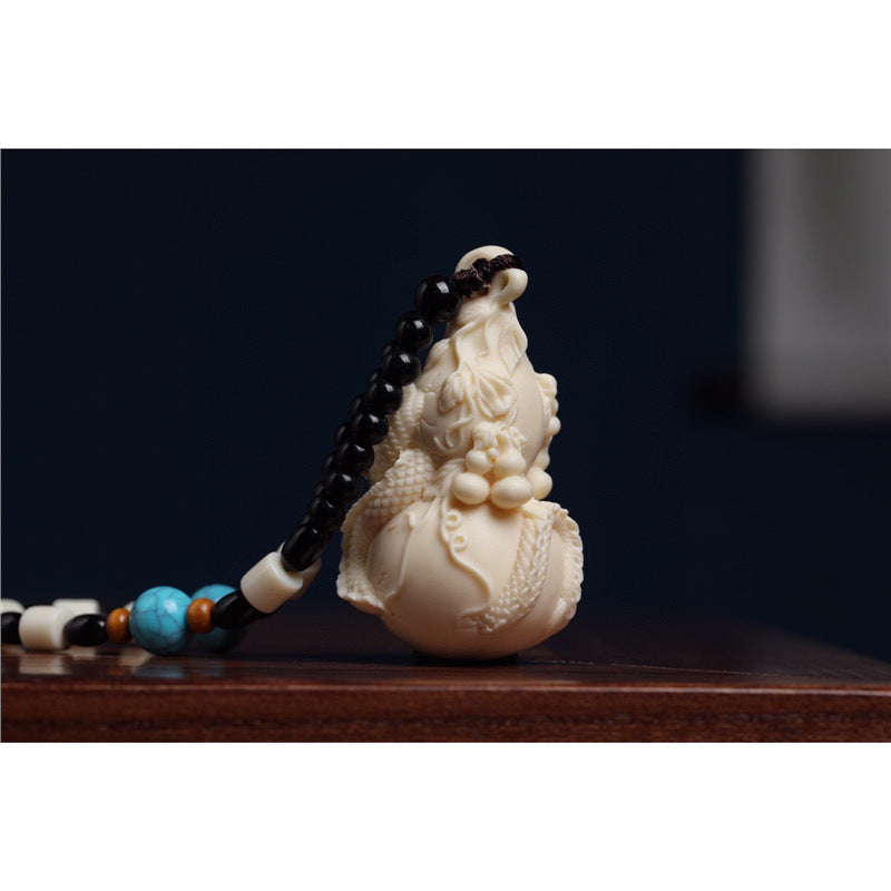 Ivory nut Soaring Dragon Ten Thousand Blessings gourd carving with bead cord, tagua vegetable ivory Chinese auspicious handpiece