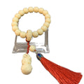 Ivory nut tagua bead bracelet with carved blessing pendant and red tassel, Chinese many blessings jewelry