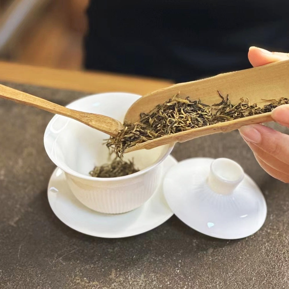 Close-up of slender Jin Jun Mei black tea leaves