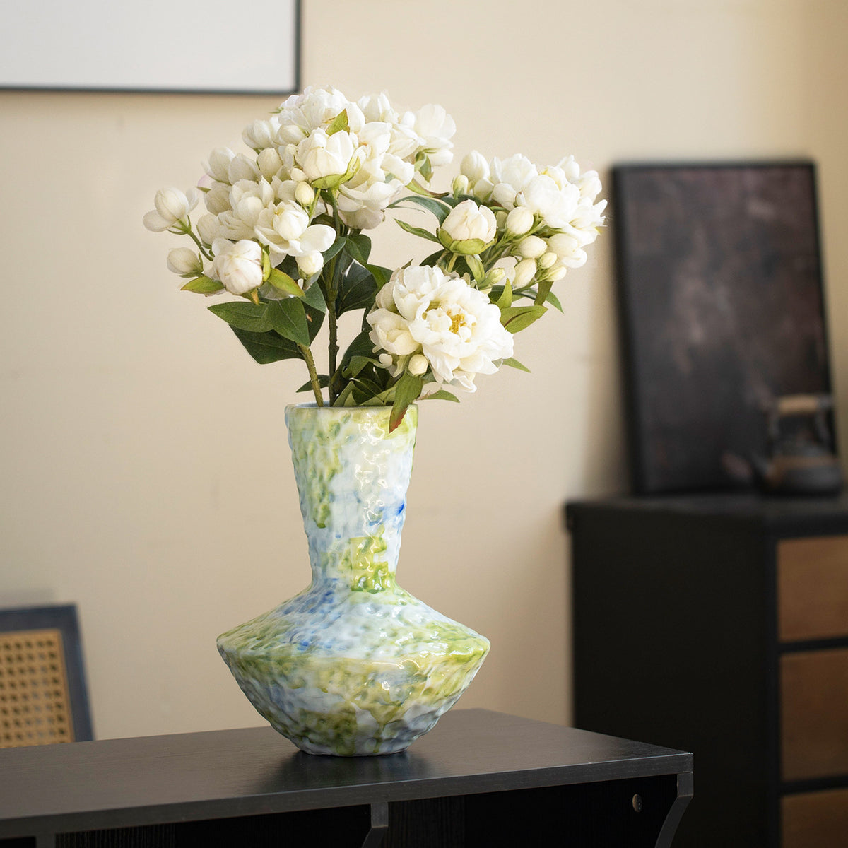Jingdezhen blue-green textured ceramic vase with white flowers