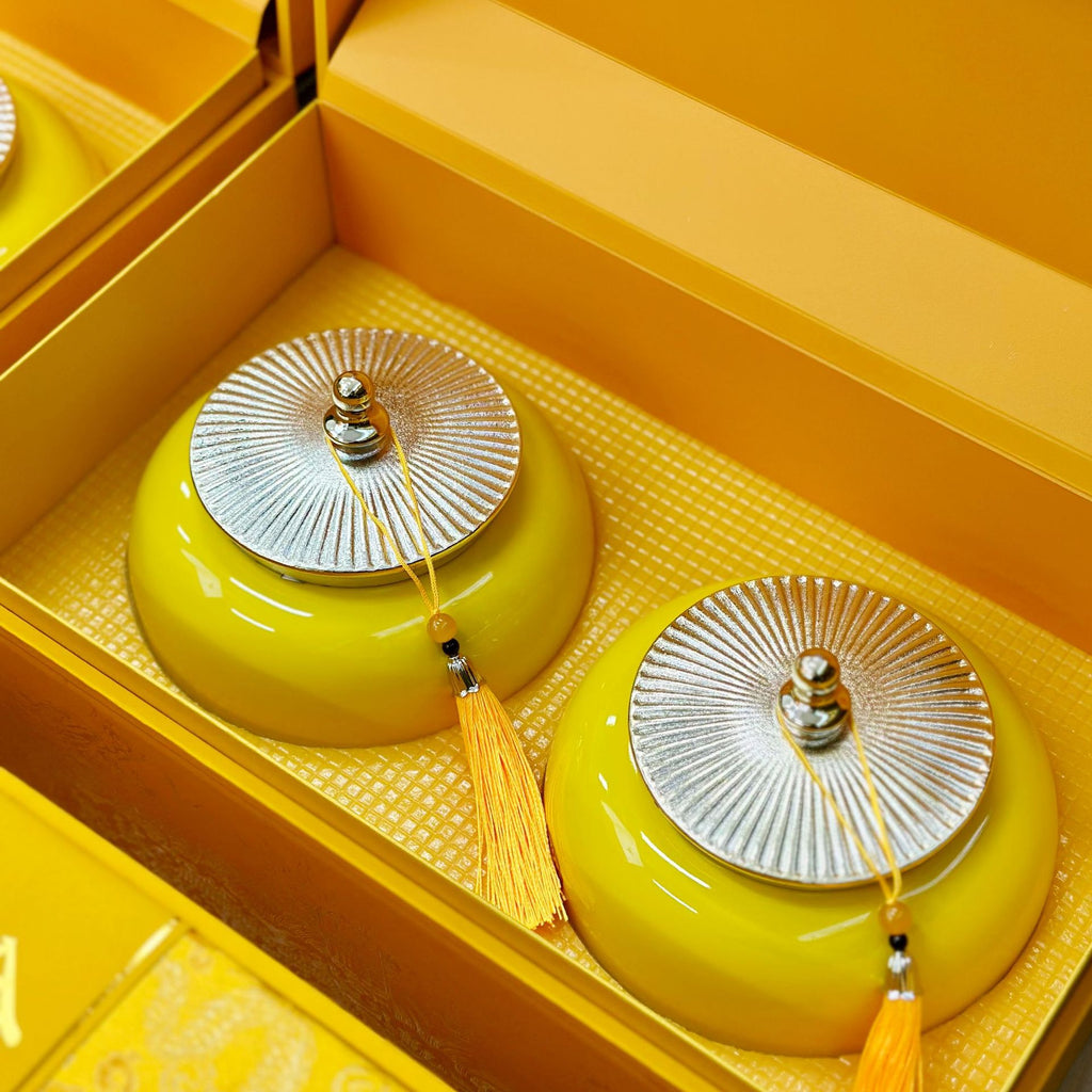 Twin yellow ceramic jars inside Jin Jun Mei gift chest