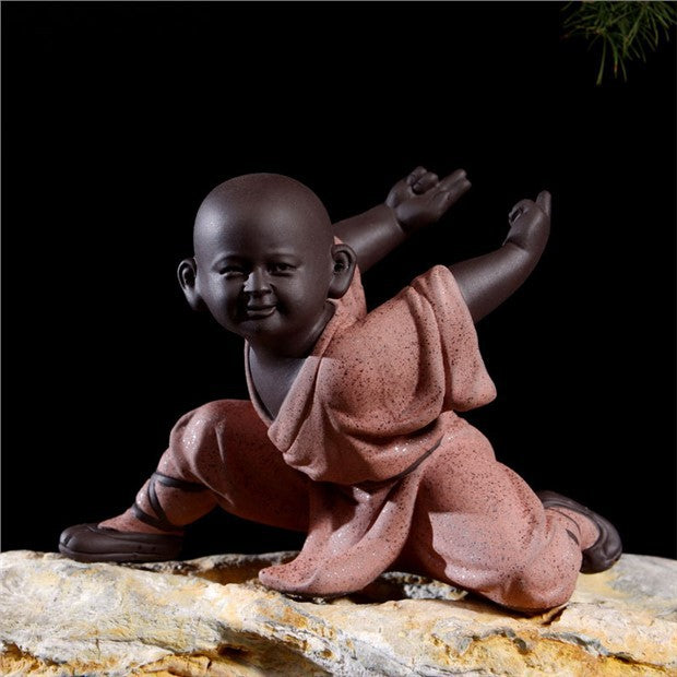 Little monk tea pet in dynamic flying crane martial arts pose