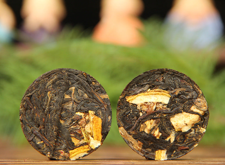 Yunnan Dianhong lemon black tea mini cakes with visible dried lemon pieces
