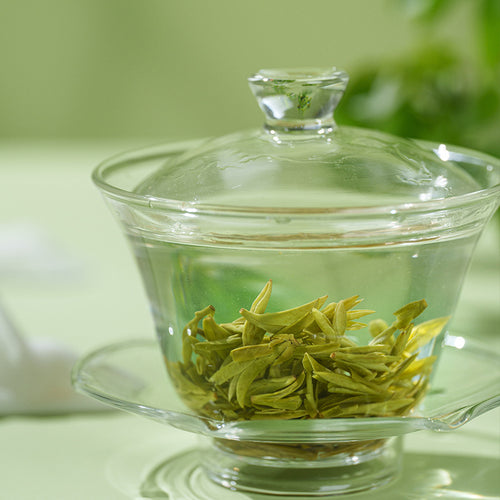 Flat pan-fired Longjing green tea leaves