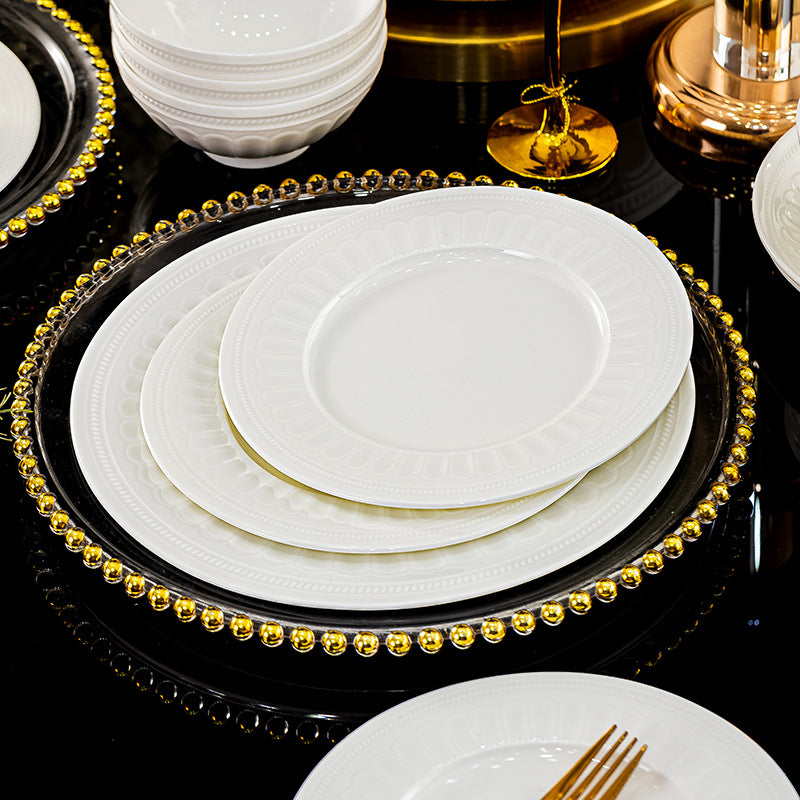 Luofu white embossed porcelain plates and bowls in a formal table setting