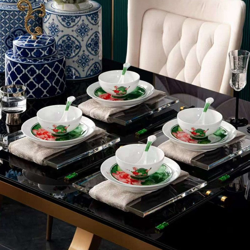 Manyuan Chunse green floral porcelain bowls and plates styled as a four-place dining setting