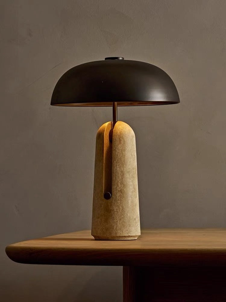 Black dome mushroom lamp with light travertine stone base