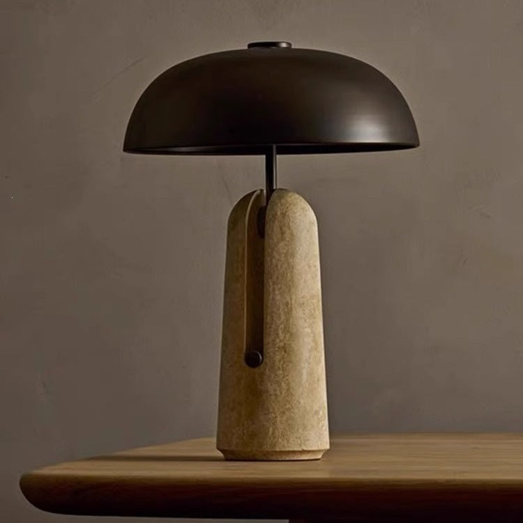 Postmodern black dome lamp with pale travertine stone base