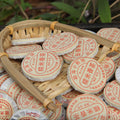 Menghai sticky rice aroma ripe Pu-erh 6g mini cakes arranged in a bamboo basket