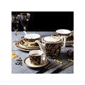 Midnight black and gold bone china tableware collection with teapot, cup and saucer, plates, bowl and chopsticks
