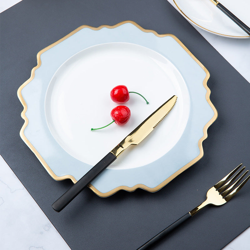 Mist blue irregular square dinner plate with gold edge styled with fruit