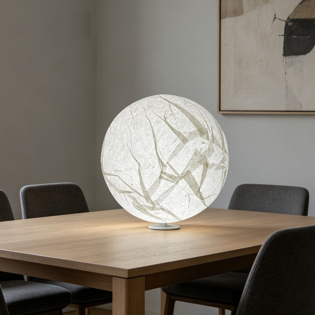 Luminous Japanese paper moon sphere lamp used as sculptural dining room lighting