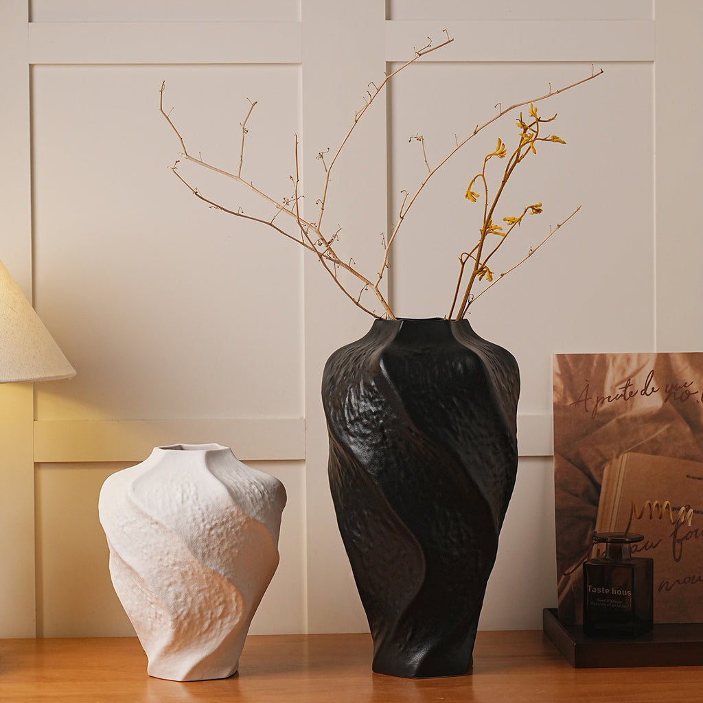 Black and white sculptural ceramic vases on New Chinese console