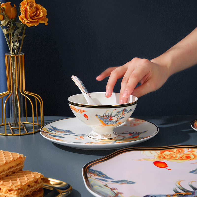 Styled bone china table setting with Chinese mythical beast motif and dessert plate
