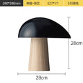 Black resin and iron mushroom table lamp with natural wood-look base, 28 cm wide and 28 cm high