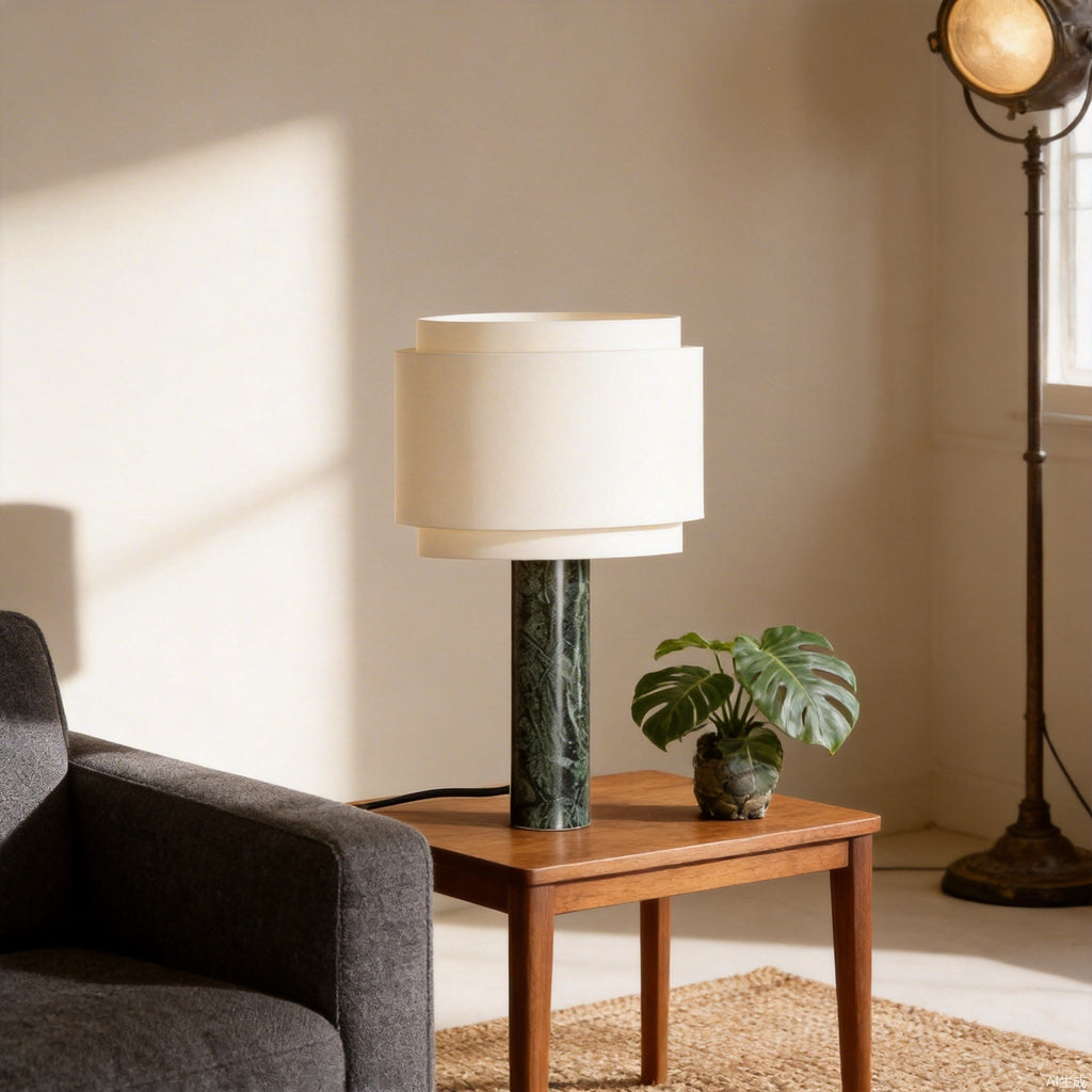 Tall green marble column lamp used as a living room accent light beside a sofa