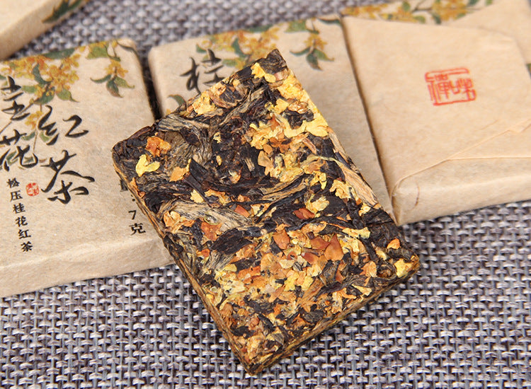 Osmanthus black tea mini brick with visible tea leaves and flowers 桂花红茶