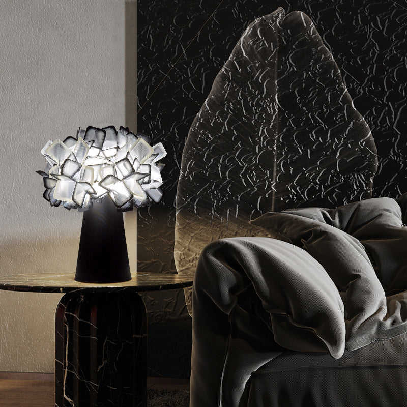 Black petal flower table lamp styled in a dramatic contemporary bedroom