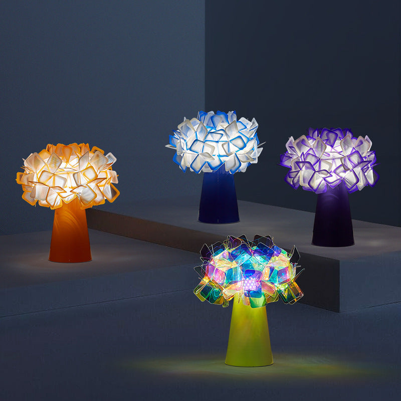 Petal flower table lamps glowing in orange, blue, purple and multicolor finishes