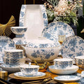 Pomegranate Blossom blue and white bone china dinnerware set with gold-tone edging, bowls, plates, fish platter and lidded tureen