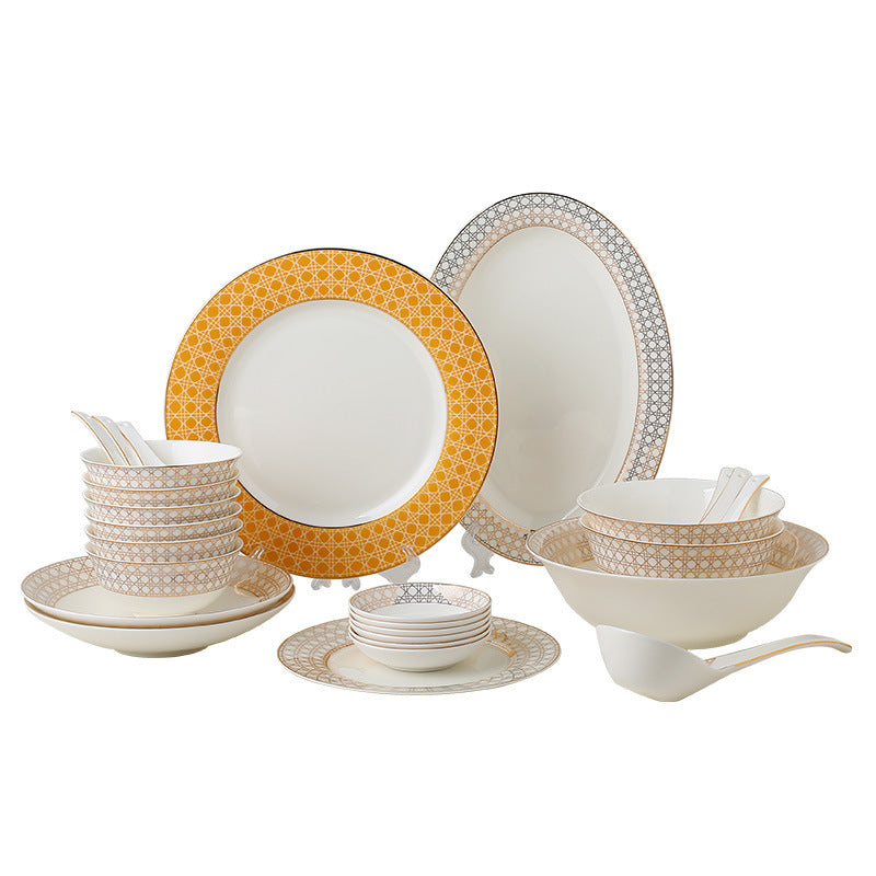 Complete Provence lattice 28-piece bone china dinnerware set on white background with plates, fish platter, bowls and spoons