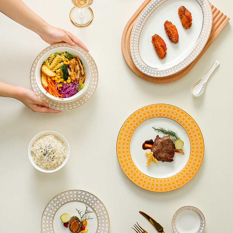 Provence lattice bone china dinnerware styled with main courses, rice and side dishes on a contemporary dining table