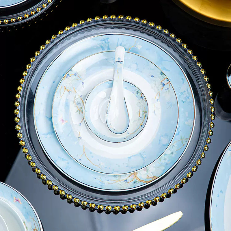 Qingmeng pale blue floral bone china plates and bowls arranged in a coordinated place setting