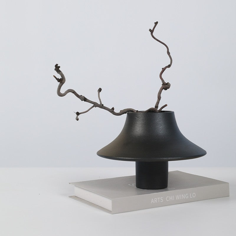 Black sculptural Chinese ceramic vase with branch