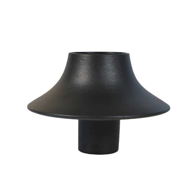 Black contemporary Chinese sculptural vase on white background