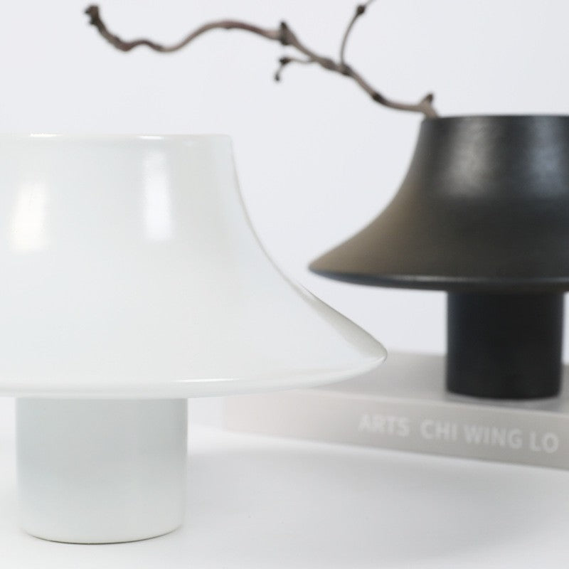 Black and white sculptural disc ceramic vases