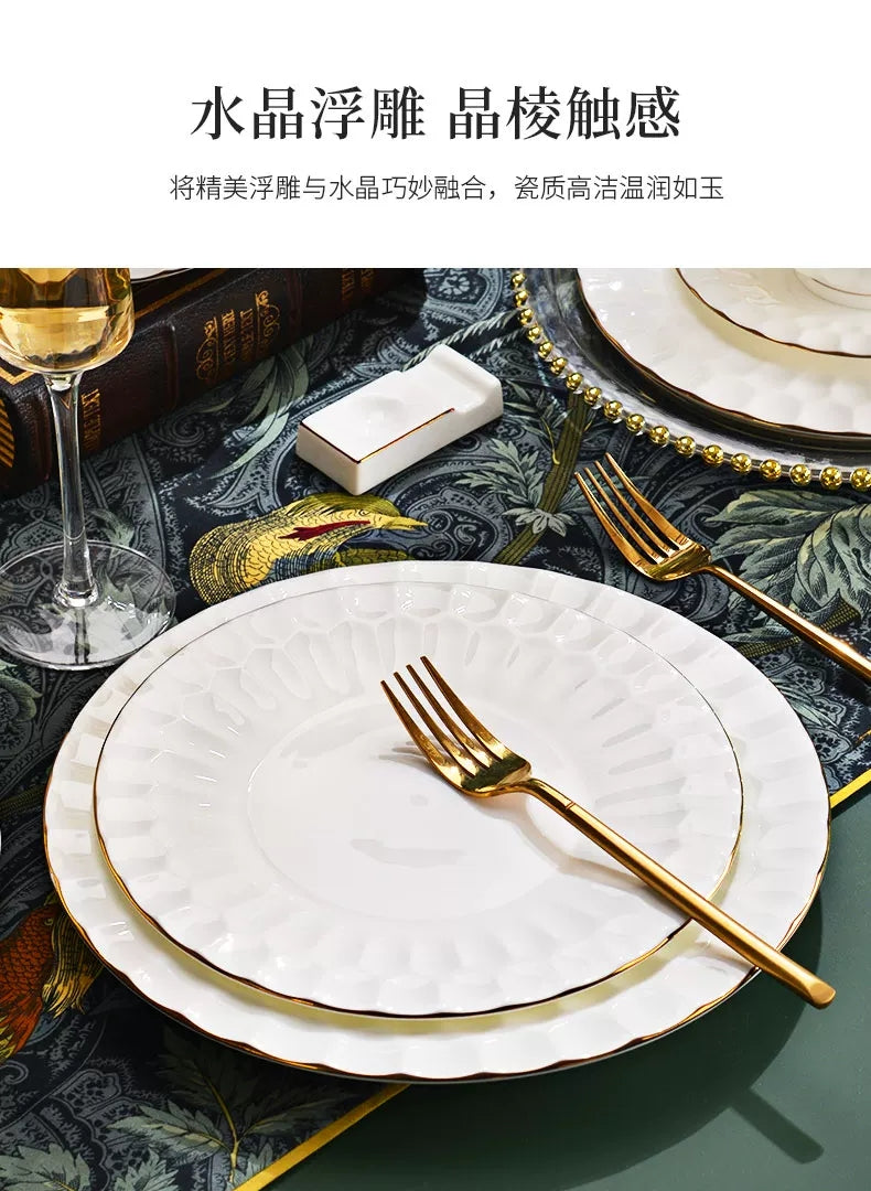 Close-up of Shuijing Zhilian embossed white bone china plates with fine gold trim