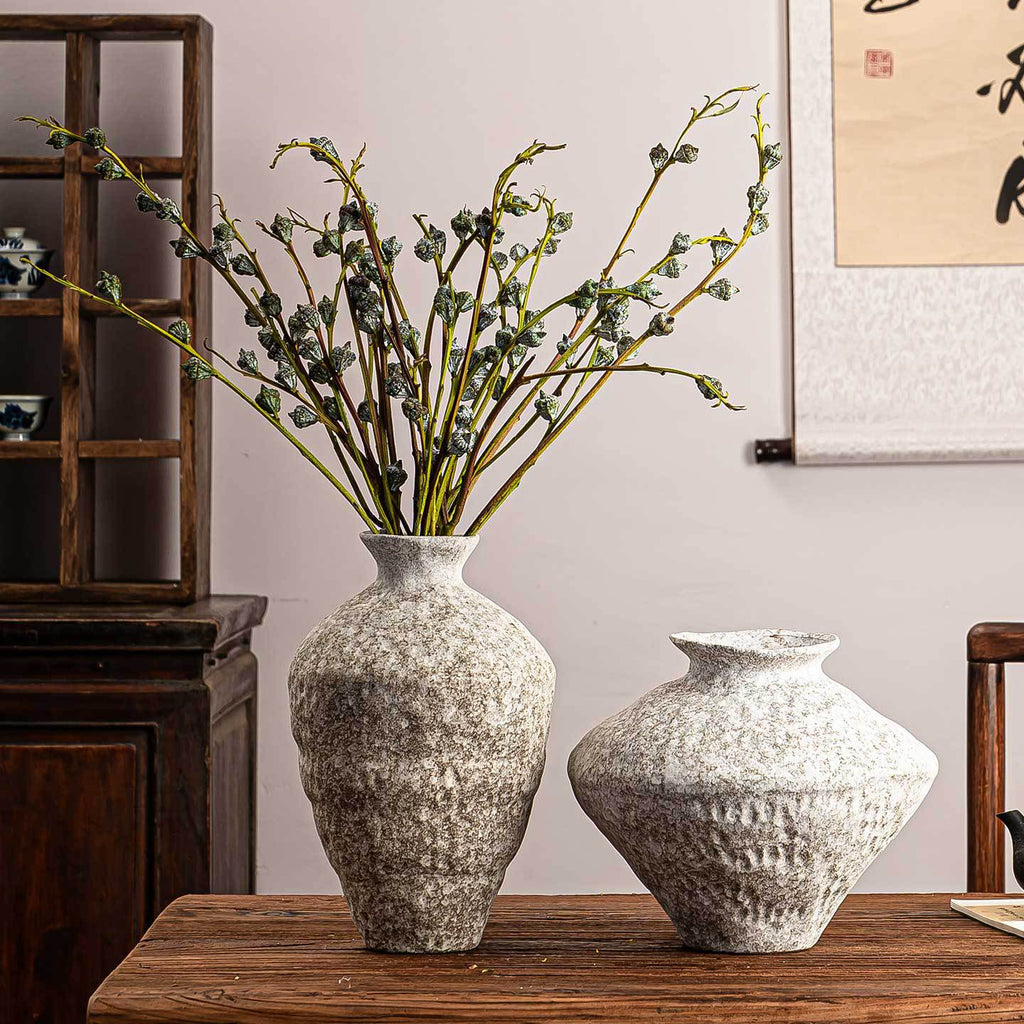 Snowfall ceramic vases styled with flowering branches in New Chinese interior