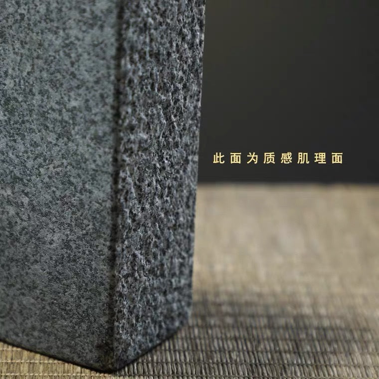 Close detail of textured stone column vessel surface