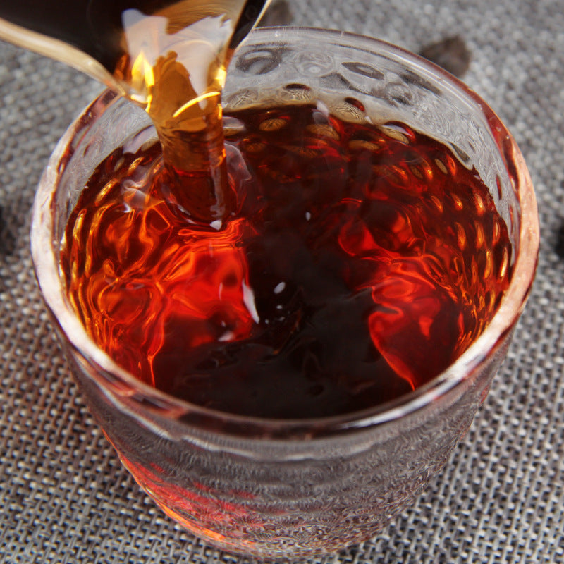 Deep amber tea liquor brewed from Tea Fossil Sui Yin Zi ripe Pu-erh