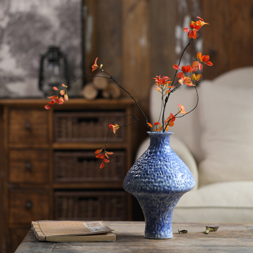 Blue textured ceramic vase in warm New Chinese interior