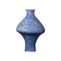 Blue textured Chinese ceramic vase on white background