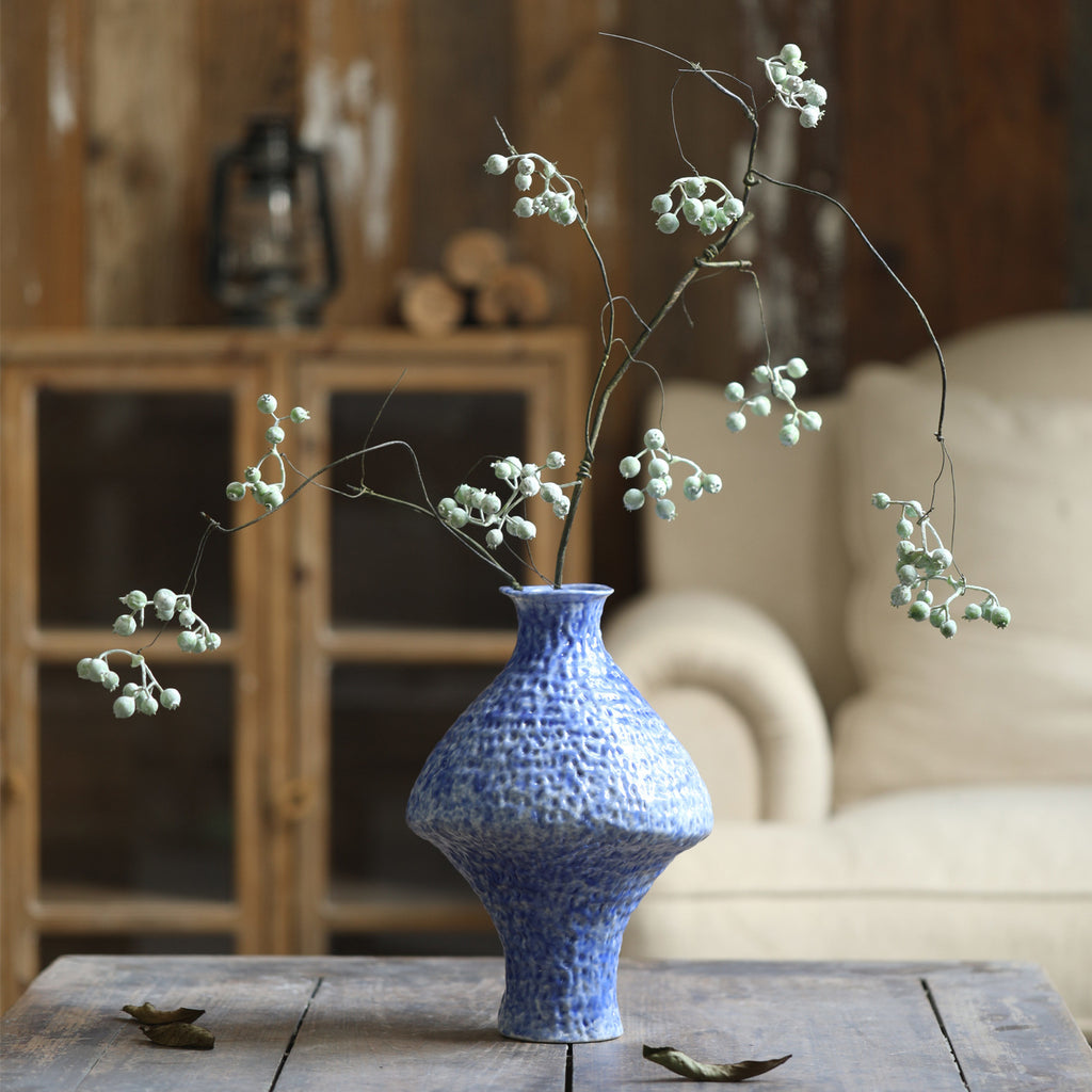 Blue textured Chinese vase with delicate flowering branches