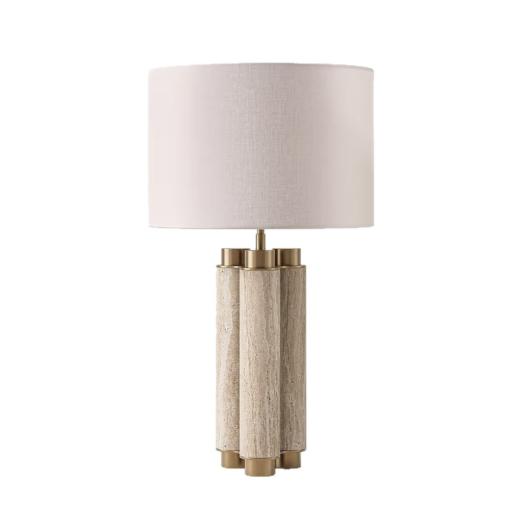 Sculptural multi-column natural travertine table lamp with brass details and linen shade