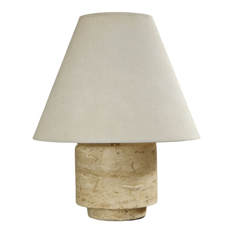 Natural travertine cylinder table lamp with neutral linen shade, isolated product view