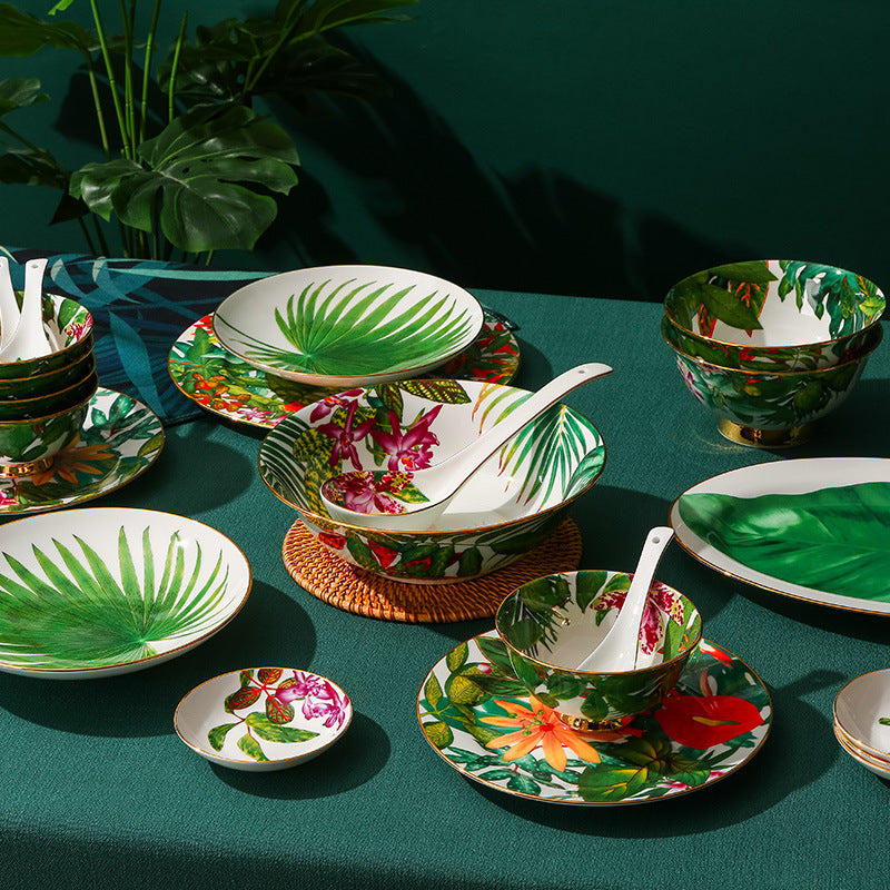 Tropical rainforest botanical bone china dinner table setting with green leaf motifs