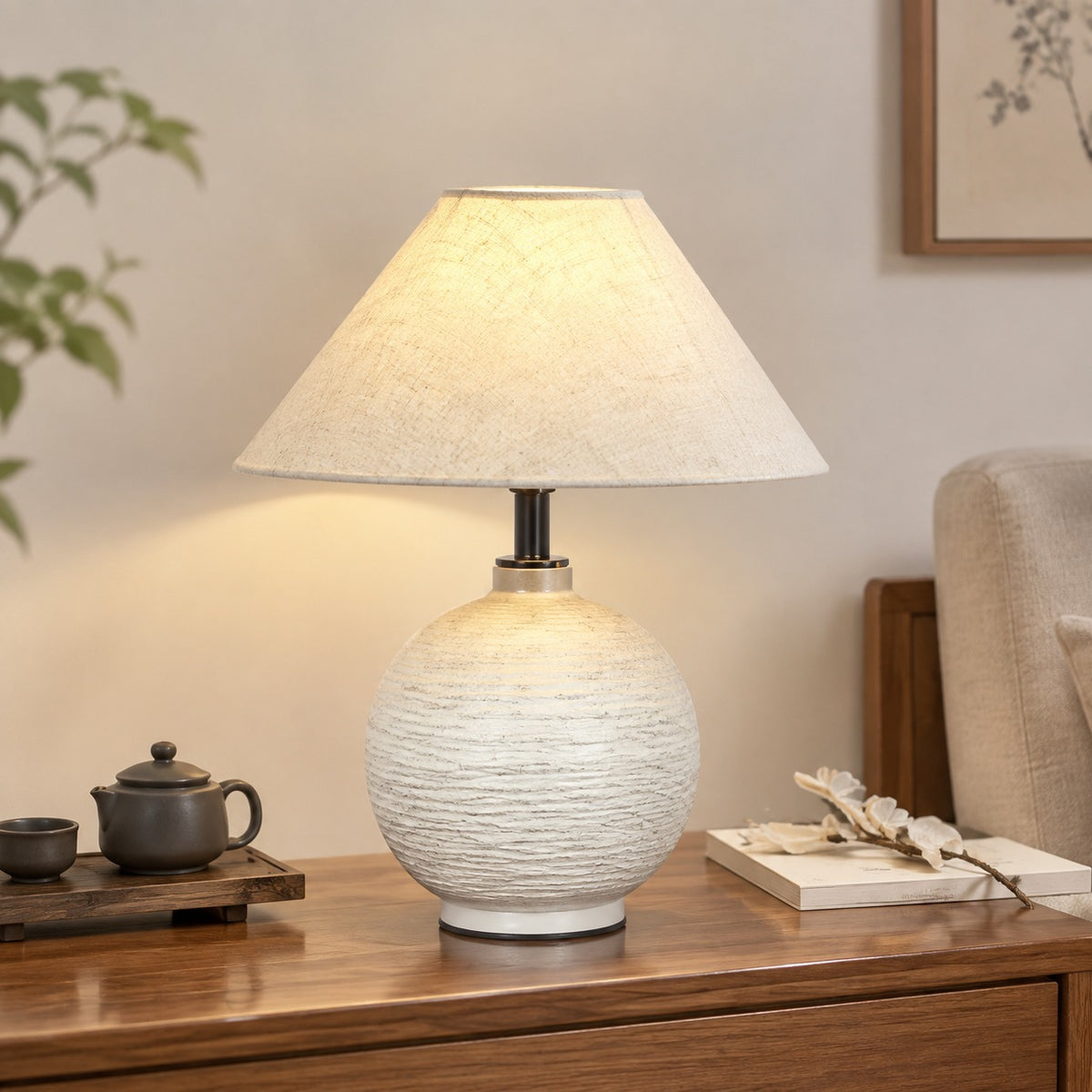 White textured ceramic lamp on a timber console in a calm contemporary room