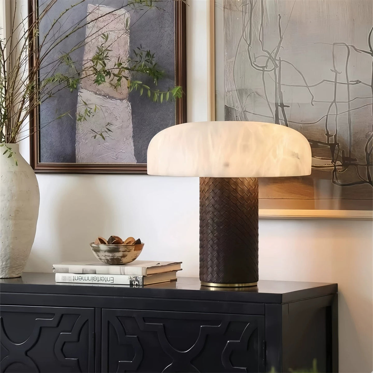 Faux alabaster dome table lamp with dark woven-texture column on a black console