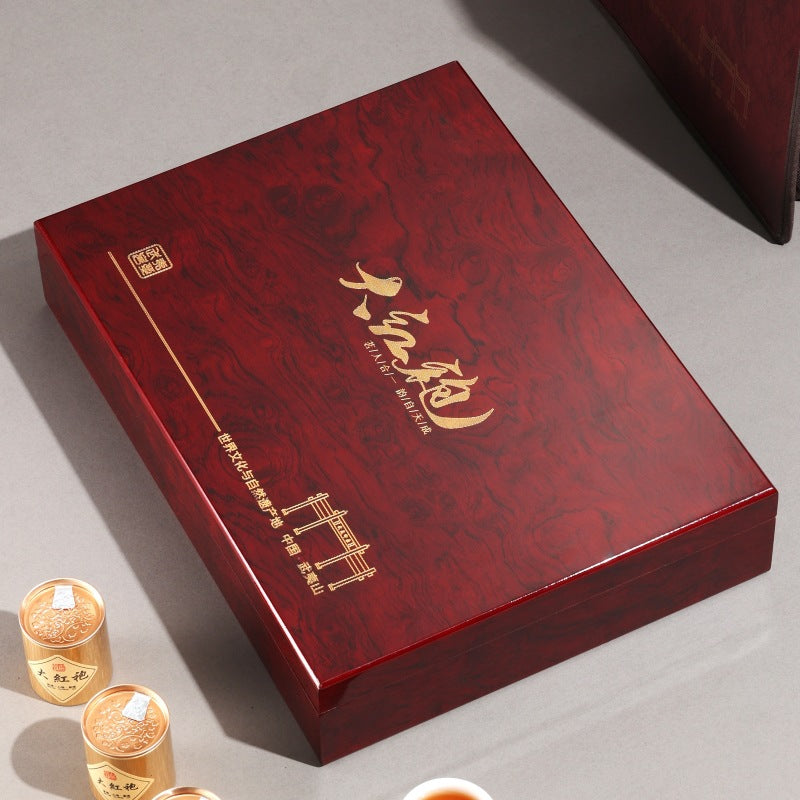 Individual mini tins of Wuyi rock tea in wooden gift box